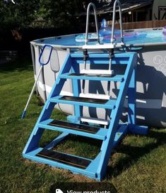 an above ground swimming pool with ladders