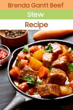 a pan filled with meat and vegetables on top of a table