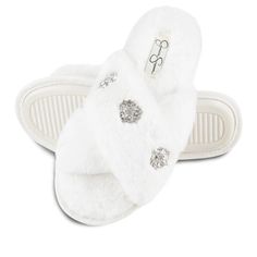 a pair of white slippers with crystal embellishments