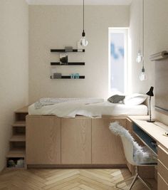 a bedroom with a bed, desk and shelves on the wall next to a window