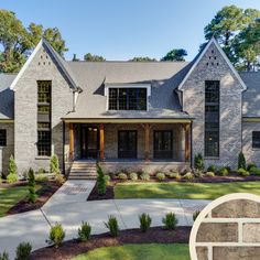 a large brick house with lots of windows