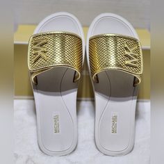 Nwt Michael Kors Authentic Women's White Gold Slip On Slides Sandals Size 10m New And With Box Perfect For A Gift If You Have Any Questions, Let Me Know Pet And Smoke-Free Home Thank You For Looking Gold Synthetic Slides For Beach, Gold Synthetic Slides With Removable Insole, Gold Synthetic Slides For Vacation, Gold Synthetic Slides With Cushioned Footbed, Casual Gold Synthetic Slides, Gold Flat Slides, Gold Open Toe Synthetic Slides, Gold Open Toe Slides, Gold Synthetic Open Toe Slides