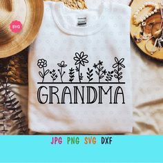 a shirt that says grandma with flowers and leaves on the front, next to other items