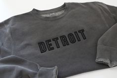 Shown as DETROIT but pick any word to be embroidered in 3D and all caps.  3D Embroidered  Independent Trading Company midweight crew 80% cotton, 20% polyester  Waahed Black Crew Black Thread  XS - 2XL These sweatshirts are pigment dyed so all will vary slightly Custom Embroidered Tops For Streetwear, Custom Embroidered Cotton Tops For Streetwear, Sporty Custom Embroidered Tops For Streetwear, Sporty Embroidered Top For Streetwear, Varsity Sweatshirt With Custom Embroidery For Streetwear, Sporty Custom Embroidery T-shirt For Streetwear, Sporty Cotton Sweatshirt With Custom Embroidery, Sporty T-shirt With Custom Embroidery, Gray Tops With Embroidered Logo For Streetwear