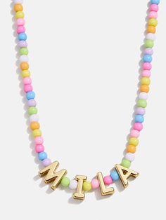 a multicolored beaded necklace with the word all spelled in gold letters