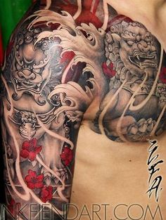 a man with a dragon tattoo on his arm and chest is posing for the camera