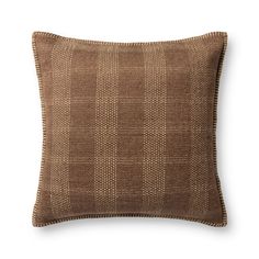 a brown pillow on a white background