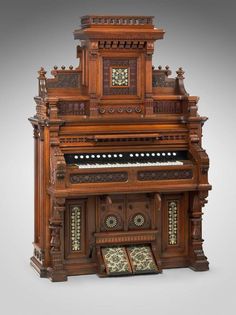 an old wooden organ with intricate carvings on it