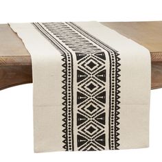 a table runner with black and white designs on it