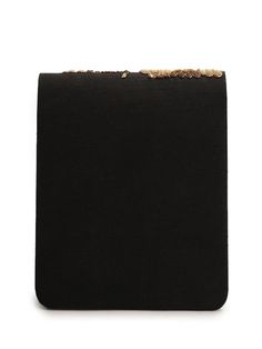 a black clutch bag with gold details on the front