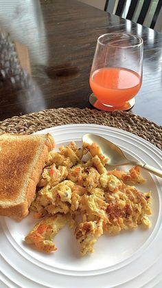 an egg salad and toast on a white plate