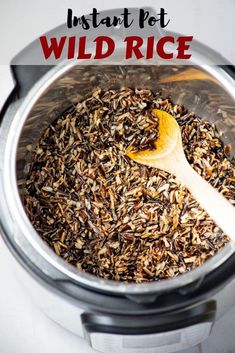 an instant pot filled with wild rice and a wooden spoon in the top right side