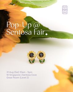 a pair of sunflowers with the words pop up @ sentosa fair on it