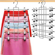 the clothes hangers are organized in different colors and sizes, along with two pairs of pants