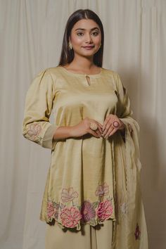 Pale yellow satin linen kurta embroidered with pearls, cutdana, beads, sequins and patchwork with delicate organza detailing on the sleeves. Comes with flowing georgette palazzo and organza dupatta.
Components: 3
Pattern: Embroidered
Type Of Work: Pearls, cutdana, beads, sequins
Neckline: U Neck
Sleeve Type: Puff
Fabric: Kurta: Satin Linen, Palazzo: Double Georgette, Dupatta: Organza
Color: Yellow
Other Details: 
Cutwork hem kurta
Scalloped hem dupatta
Attached lining
Approx.. Product weight: 1- Georgette Palazzo, Yellow Kurta, Kurta Palazzo Set, Fabric Print Design, Georgette Dupatta, Yellow Satin, Kurta Palazzo, Palazzo Set, Organza Dupatta