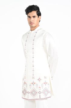 Ivory Phulkari inspired Nehru Jacket with pipe, cutdaana and thread work embroidery with same coloured kurta with embroidery detail on the chest and sleeve. this set in made in linen Satin, Paired with Ivory slim fit Pant Pajama. Color of
the actual garment may vary due to lighting conditions during the shoot.

Size Chart For Men





	
	
					Men's Size Chart
		

		
		
						
				Size Chart For Men
				Custom Size Measurement Guide
			
			
				
				
				Custom Size Measurement Guide
1. Take you Festive Long Sleeve Floral Bandhgala, Ceremonial Off White Kurta With Resham Embroidery, Traditional Bandhgala With Embroidered Sleeves For Eid, Cream Long Sleeve Bandhgala With Resham Embroidery, Festive Long Sleeve Bandhgala With Multicolor Embroidery, Straight Kurta With Intricate Embroidery, Designer Long Sleeve Nehru Jacket With Floral Embroidery, Designer Floral Embroidery Kurta For Transitional Season, Traditional Off White Bandhgala With Chikankari Embroidery