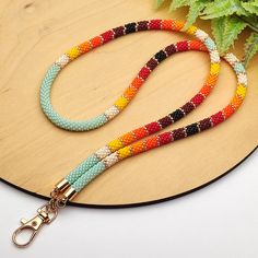 This turquoise bead lanyard for badge is made of Japanese seed beads of superior quality beads. Lanyards are perfect for keys, ID cards, badges, name tags, keychains, usb, passport, whistle, compass, ticket, camera, phone, wallet. *SIZE: Lanyard lenght : 28 inches Lenght with holder: 15.5 inches All products are 100% handmade, made with love especially for you. Piece of my soul, which I left in this work, will warm you even in the most difficult and sad days. I am sure; this jewelry will become your lucky charm that you would enjoy wearing day and night. Beaded Feathers Native American, Native Beading Patterns Tutorials, Beaded Keychains Native American, Beaded Lanyard Patterns, Seed Bead Lanyard, Beaded Feathers, Bead Lanyard, Beaded Hat Bands, Fancy Accessories