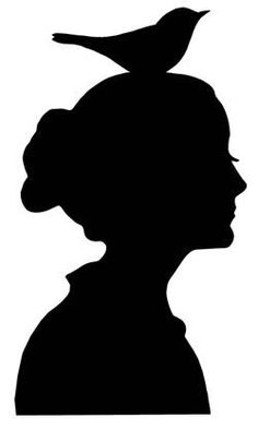 the silhouette of a woman with a bird on her head