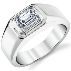 a white gold ring with an emerald cut diamond in the center, on a white background