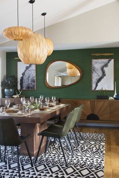 the dining room is decorated in green and black