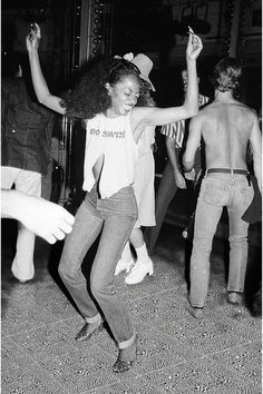 black and white photograph of people dancing on the dance floor