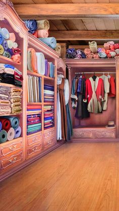 a painting of a closet filled with lots of different colored clothes and fabrics on shelves