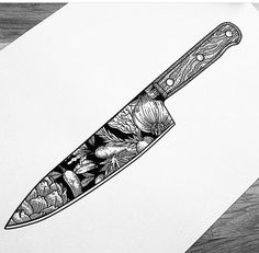 a black and white drawing of a knife on a piece of paper with flowers in it