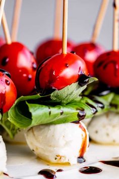 small appetizers with cherry tomatoes and mozzarella cheese on skewers