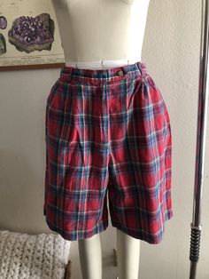 Vintage high rise plaid shorts, good condition, women's size 12 runs smaller. Shown here on a women's size 4 mannequin. Please use measurements for reference as vintage sizes vary. Measurements laying flat, not doubled 13.75 inch waist (also has elastic on the back of waistband) 21 inches in length All sales final, thanks for looking :) Plaid High-waisted Cotton Shorts, Plaid Short Bottoms For Fall, High-waisted Plaid Bottoms With Built-in Shorts, Fitted Plaid Shorts, Fall Plaid Shorts, Vintage Plaid Bottoms For Summer, Plaid High-waisted Fitted Shorts, Fitted Plaid High-waisted Shorts, Vintage Plaid Summer Bottoms