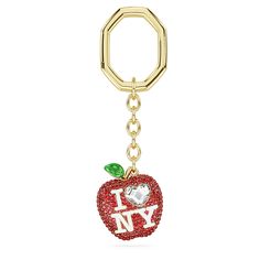 a key chain with an apple and the word i love ny on it's side