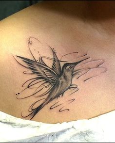 a woman with a bird tattoo on her chest