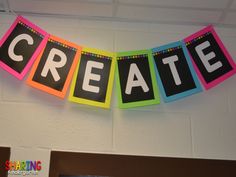 a sign that says create hanging on the wall