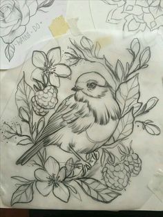 a bird sitting on top of a piece of paper with flowers and leaves around it