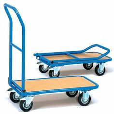 two blue hand trucks with wooden boards on the sides and one is attached to each other