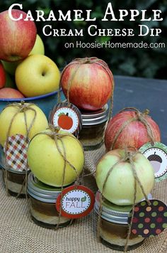 apples in jars tied with twine and labeled happy fall