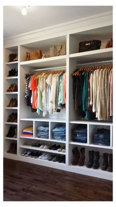 the closet is full of clothes and shoes