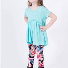 Made From Easy To Care For Rayon Spandex Knit, This Flattering And Fun Top Is Perfect With Your Favorite Kids Leggings Or Jeans. 95% Polyester 5% Spandex Arched Empire Waist. Gathered Peplum. Rounded Neckline Flattering 'Perfect Sleeve, Hip Grazing Hem Made In The Usa From Imported Materials New With Tags From Smoke And Pet Free Boutique. Sizes: Xxs - Child's 1-2 Xs - Child's 2-4 S - Child's 4-6 M - Child's 7-8 L - Child's 10-12 Xl - Child's 12-14 Playful Stretch Tops For Playtime, Stretch Playful Tops For Playtime, Playful Fitted Blue Tops, Casual Fitted Tops For Playtime, Light Blue Tops For Playtime In Spring, Cute Light Blue Tops For Playwear, Light Blue Tops For Spring Playtime, Summer Stretch Tops For Playtime, Playful Light Blue Tops For Loungewear