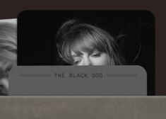 a black and white photo of a woman looking at her cell phone with the words the black dog on it