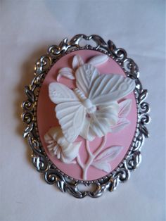 "It has a beautiful Large pink & white butterfly Cameo.The brooch is 2\" ( 5 cm) in length and on the back you have a silver tone brooch clasp. Combined shipping on multiple items." White Cameo Brooches For Formal Occasion, White Cameo Brooch For Formal Occasions, Victorian Pink Brooches For Wedding, White Cameo Brooches For Wedding, White Cameo Brooch For Wedding, White Cameo Wedding Brooches, Elegant Pink Brooches For Collectors, White Butterfly Brooches For Gifts, Victorian Style White Cameo Brooches