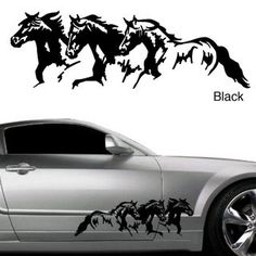 a car with three horses on it's side and the word black in front