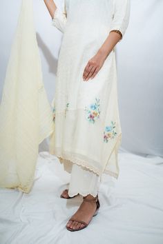 Off white embroidered kurta with multicoloured floral motifs. Paired with schiffli pant and dupatta.
Component: 3
Pattern: Embroidered
Type Of Work: Thread work
Neckline: Boat neck
Sleeve Type: Three quarter
Fabric: Cotton, Voile
Color: White
Other Details: 
Cutwork hem pant
Crinkle cotton dupatta
Occasion: Work - Aza Fashions Cotton Sharara With Sheer Dupatta For Wedding, Off-white Palazzo Set With Dupatta And Straight Kurta, Unstitched White Chanderi Sets, Unstitched White Traditional Wear For Spring, White Straight Kurta With Sheer Dupatta, Off White Embroidered Sets With Traditional Drape, Diwali Off White Palazzo Set With Chikankari Embroidery, Off White Embroidered Set With Traditional Drape, Diwali Off-white Palazzo Set With Chikankari Embroidery