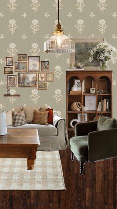 a living room filled with furniture and pictures on the wall