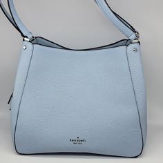 Brand: Kate Spade Style: Leila Medium Triple Compartment Shoulder Bag Condition: New With Tag Exterior Color: Ocean Fog Interior Features: Center Zipper Compartment; Inside Zip And Multifunction Pockets Closure: Magnetic Snap; Zipper Hardware Color: Silver Straps: Two Shoulder Straps Approx. Measurements: 10.5" L Across Top (Or 12" Across Bottom) X 10.5" H X 5" W No Lowball Offers Or Trades Please. Thank You For Looking! Luxury Blue Hobo Bag With Top Handle, Luxury Blue Top Handle Hobo Bag, Light Blue Formal Shoulder Bag, Formal Light Blue Top Handle Shoulder Bag, Designer Light Blue Formal Bags, Formal Light Blue Shoulder Bag, Light Blue Formal Crossbody Bag, Formal Light Blue Crossbody Bag, Luxury Blue Hobo Bag For Travel