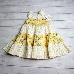 New With Tags Catherine Malandrino Multi Tier Floral Sundress Spring Summer Infant Baby Girl Size 18 Months This Summer Dress Is Absolutely Precious. It Is Yellow, White And Green With Flowers. The Dress Has Multiple Tiers With Ruffles With Delicate Diamond Embroidered Like Stitching Throughout The Fabric. It Has Shoulder Straps With Delicate Flounce Cap Sleeves. The Back Of The Dress Has A Flower Button Fastener. The Dress Is Lined With A Solid White Slip. It Brand New With Tags. Cottagecore Co Fitted Yellow Playful Dress, Cute Yellow Ruffled Sundress, Cute Yellow Sundress With Ruffles, Fitted Yellow Dress For Playtime, Playful Yellow Dress With Ruffles, Playful Yellow Ruffled Dress, Yellow Cotton Dresses With Ruffles, Yellow Cotton Dress With Ruffles, Cotton Lemon Print Sundress