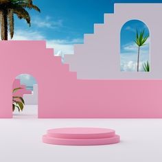 there is a pink and white building with palm trees in the backgrounge