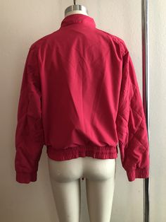 Vintage pink Reebok lightweight jacket. Good condition but the collar drawstring is missing and there's a couple spots on the picket (shown in last photos). Size tag is faded, shown here on a size 4 mannequin, should fit up to a medium but please use measurements below for reference as vintage sizes vary. Measurements laying flat: 21 inches pit to pit 24 inches from back of collar (upturned) to hem Thanks for looking :) Pink Athleisure Outerwear With Ribbed Cuffs, Pink Sports Outerwear With Ribbed Cuffs, Pink Cotton Athleisure Outerwear, Casual Pink Cotton Track Jacket, Collar Upturned, Trucker Jacket Men, Pink Reebok, Chambray Denim Shirt, Womens Sweatshirts