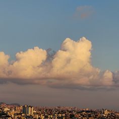 the clouds are gathering in the sky over the city