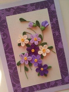 there is a card with flowers made out of buttons on the front and back of it