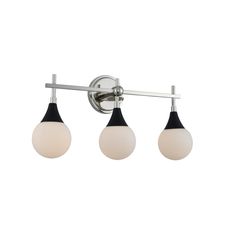 three light bathroom fixture with black and white glass globes on the sides, in an antique