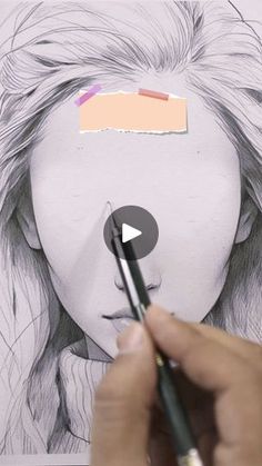 someone is drawing a woman's face with pencils